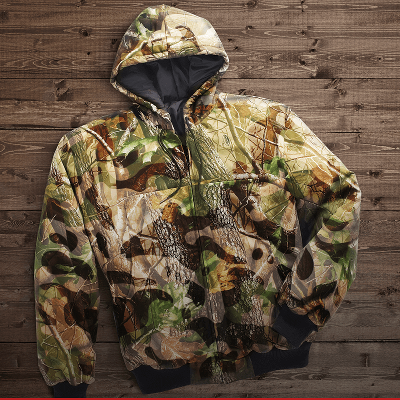 Camouflage jacket on wooden background.