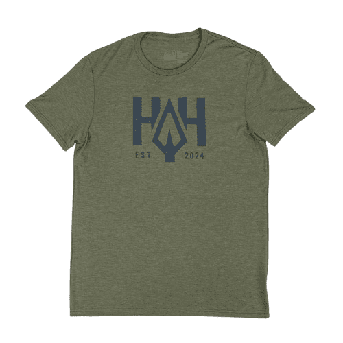 Green t-shirt with a blue geometric logo and text design.